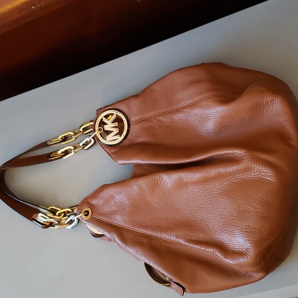 Michael Kors Handbags - Michael KORS Fulton Large leather purse NWOT